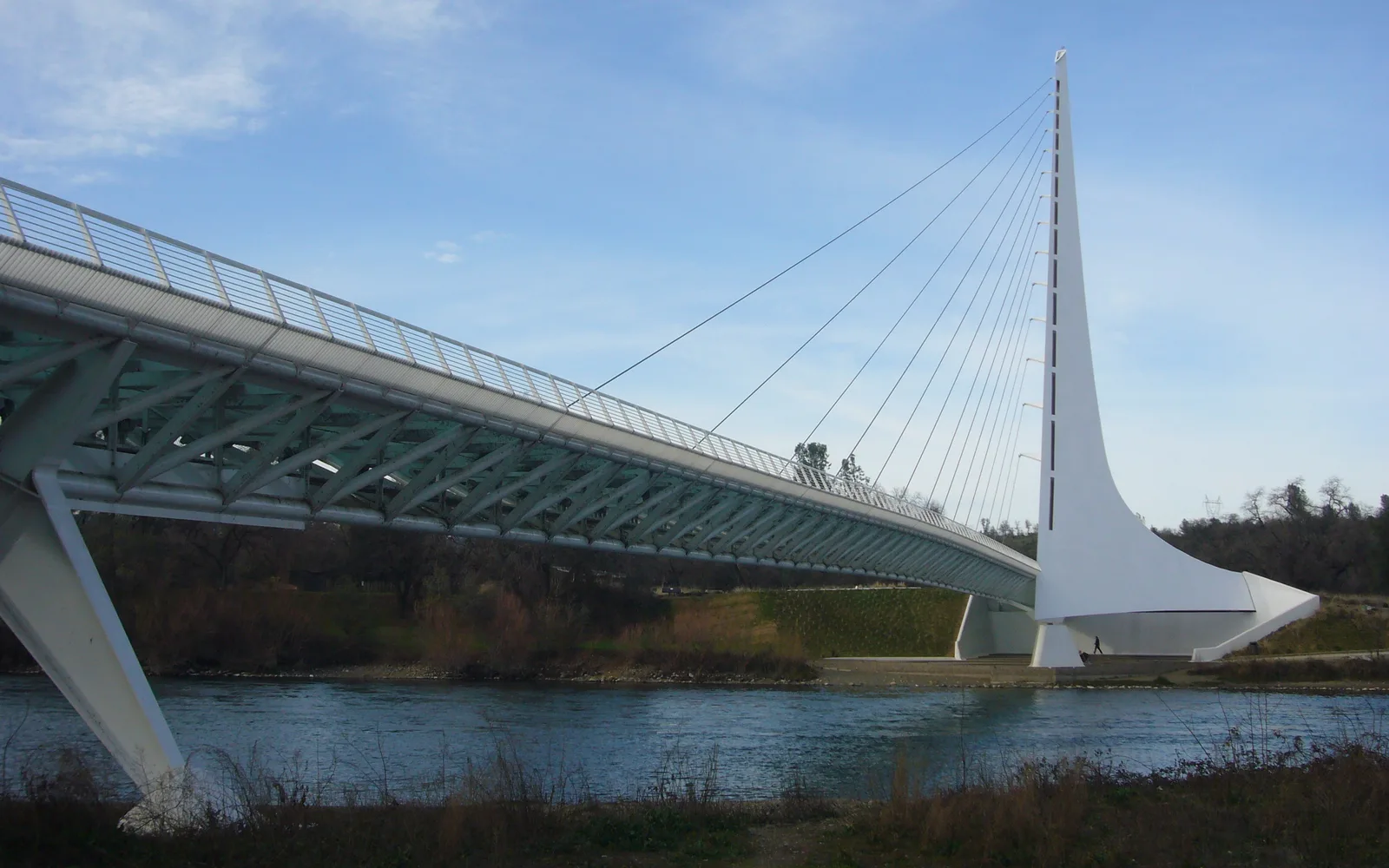 The Sundial Bridge in Redding, a cable-stayed pedestrian bridge with a tall pylon rising above the Sacramento River